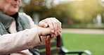 Hands, cane and elderly man in nature for walking for fresh air, exercise or peace in a park. Environment, closeup and senior male person in retirement with a stick for support in outdoor garden.