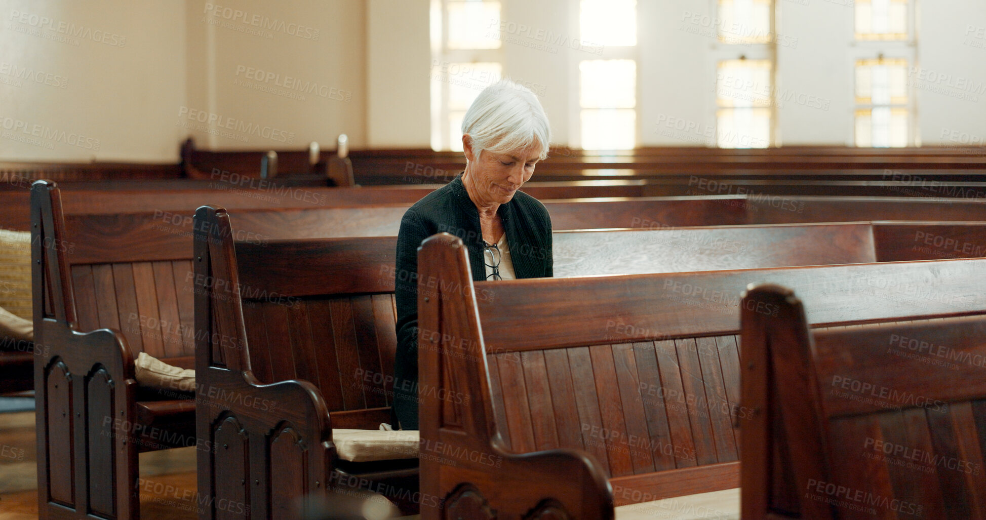 Buy stock photo Church, bible or senior Christian woman ready to worship God, holy spirit or religion in cathedral alone. Faith, mature spiritual lady or elderly person in chapel praying to praise Jesus Christ