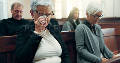 Sad, funeral or old woman crying in church for God, holy spirit or religion in cathedral or Christian community. Tissue, depressed or upset elderly person in chapel or sanctuary for Jesus Christ