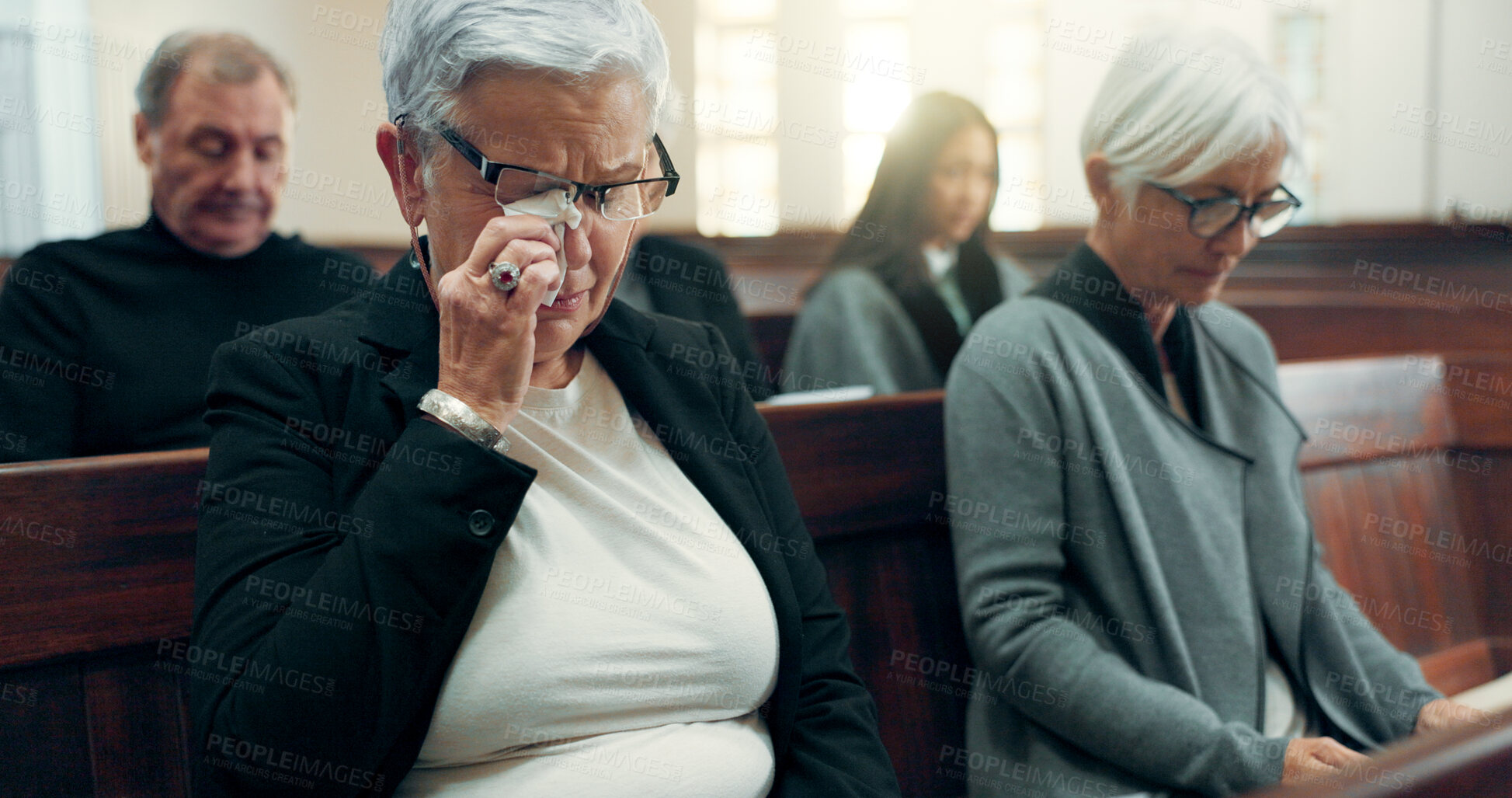 Buy stock photo Sad, funeral or old woman crying in church for God, holy spirit or religion in cathedral or Christian community. Tissue, depressed or upset elderly person in chapel or sanctuary for Jesus Christ