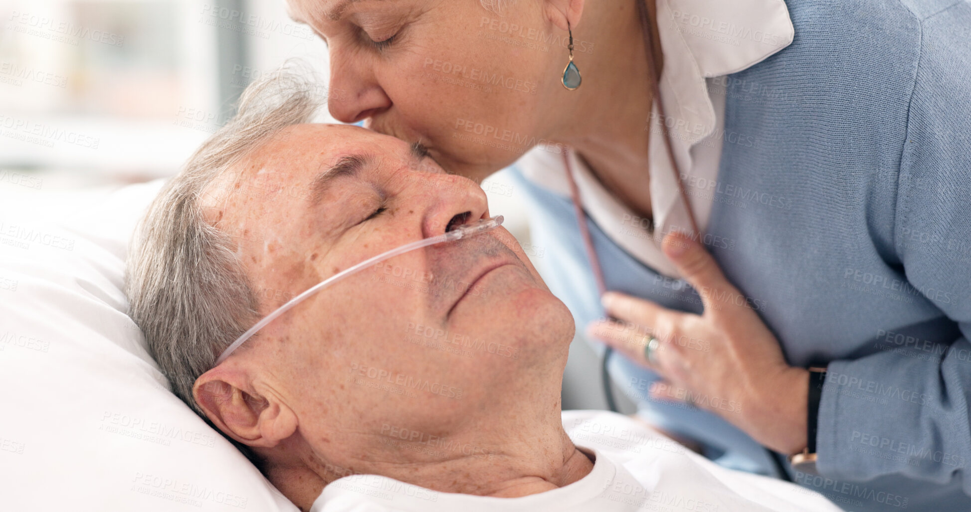 Buy stock photo Drip, hospital bed and senior man sleeping with ventilation and breathing tube in a clinic. Elderly patient, medical care and wife support with male person at a doctor for wellness and healthcare