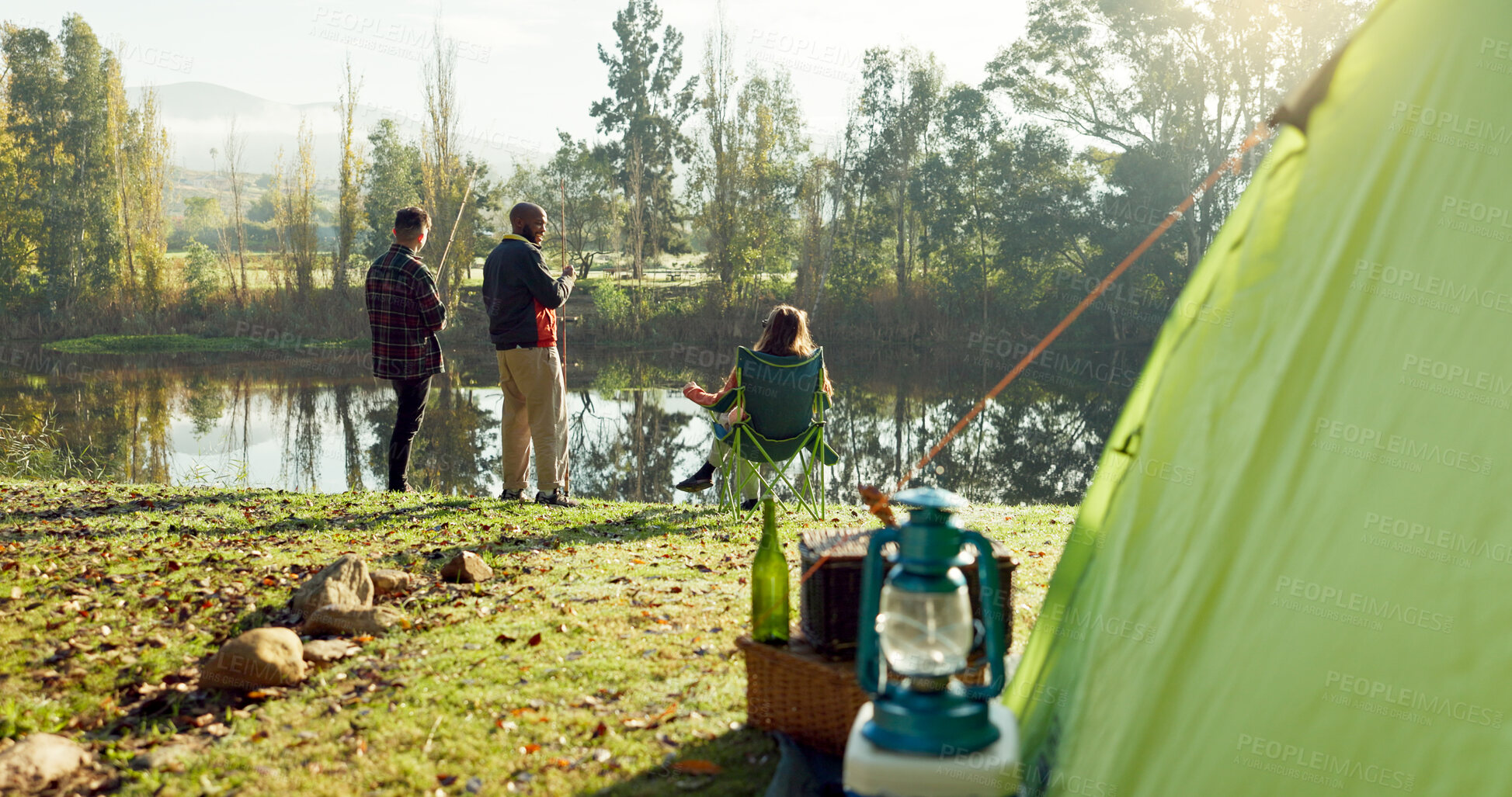 Buy stock photo Fishing, camping and friends by lake in nature on holiday, adventure and vacation together outdoors. Campsite, relax and men and woman with rod by river for sports hobby, activity and catch fish