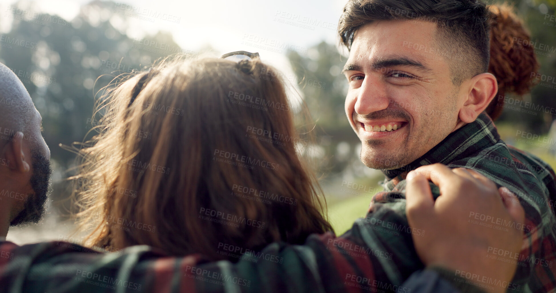 Buy stock photo Happy, face and man with friends on lake, camping in nature or group laughing and bonding on outdoor picnic at the park. Portrait, person or smile in conversation, social gathering or relax in woods