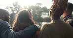 Happy, face and woman with friends on lake, camping in nature or group laughing and bonding on outdoor picnic at the park. Portrait, smile and girl relax in conversation or social gathering in woods