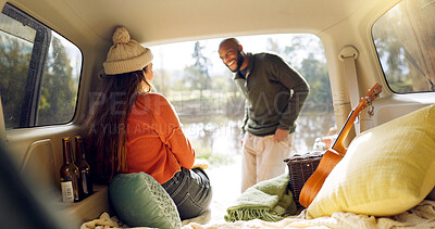 Winter and a couple in a car for a road trip, date or watching the view together. Happy, travel and back of a man and woman with an affection in transport during a holiday or camping in nature