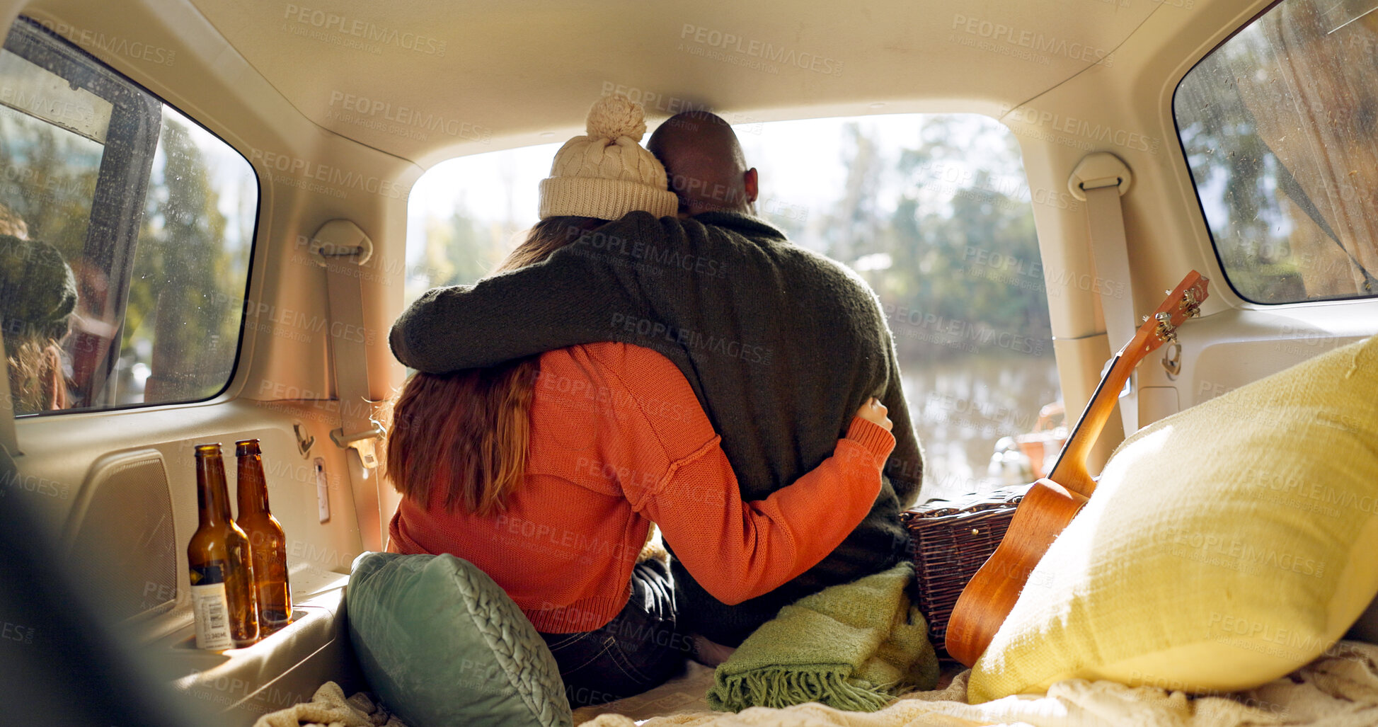 Buy stock photo Hug, winter and a couple in a car for a road trip, date or watching the view together. Happy, travel and back of a man and woman with an affection in transport during a holiday or camping in nature