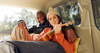 Singing with Guitar, winter and a couple in a car for a road trip, date or watching the view together. Happy, travel and back of a man and woman with an affection in transport during a holiday or camping in nature