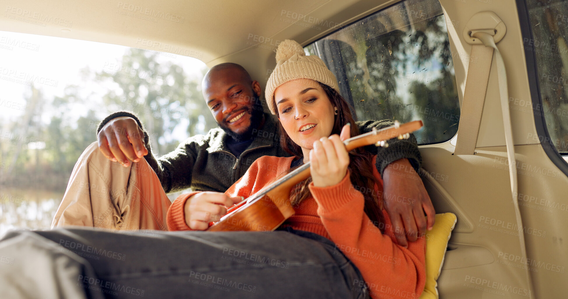 Buy stock photo Singing with Guitar, winter and a couple in a car for a road trip, date or watching the view together. Happy, travel and back of a man and woman with an affection in transport during a holiday or camping in nature