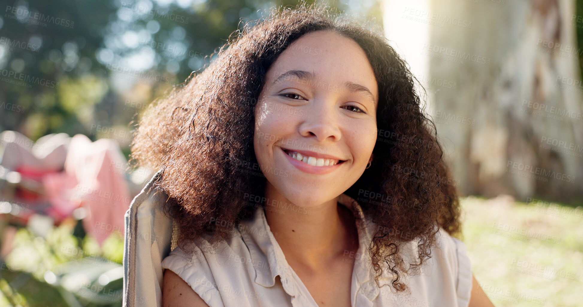 Buy stock photo Nature, face of happy woman in chair and camping in forest for vacation, adventure and freedom. Relax at camp, smile and girl sitting in woods with trees, grass and happiness on eco friendly holiday.