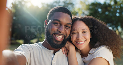 Love, selfie and face of a couple in nature on a romantic date in a garden while on a holiday. Happy, smile and portrait of African young man and woman taking picture together in park on weekend trip