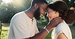 Love, nature and couple dancing with an intimate moment on a romantic date in a garden on holiday. Happy, smile and African young man and woman moving with affection in park on weekend trip together.