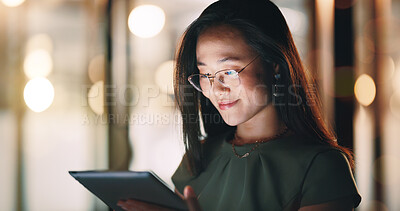 Corporate woman, reading tablet and night with smile, focus and happy for email communication, chat or app. Asian executive, social media marketing and working in night on web, tech or social network
