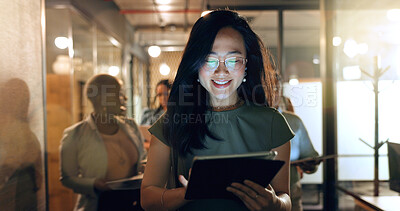 Buy stock photo Night, tablet and business people walking in office after finishing work task. Tech, overtime and Asian woman with group of friends going home after working late on sales project in dark workplace.