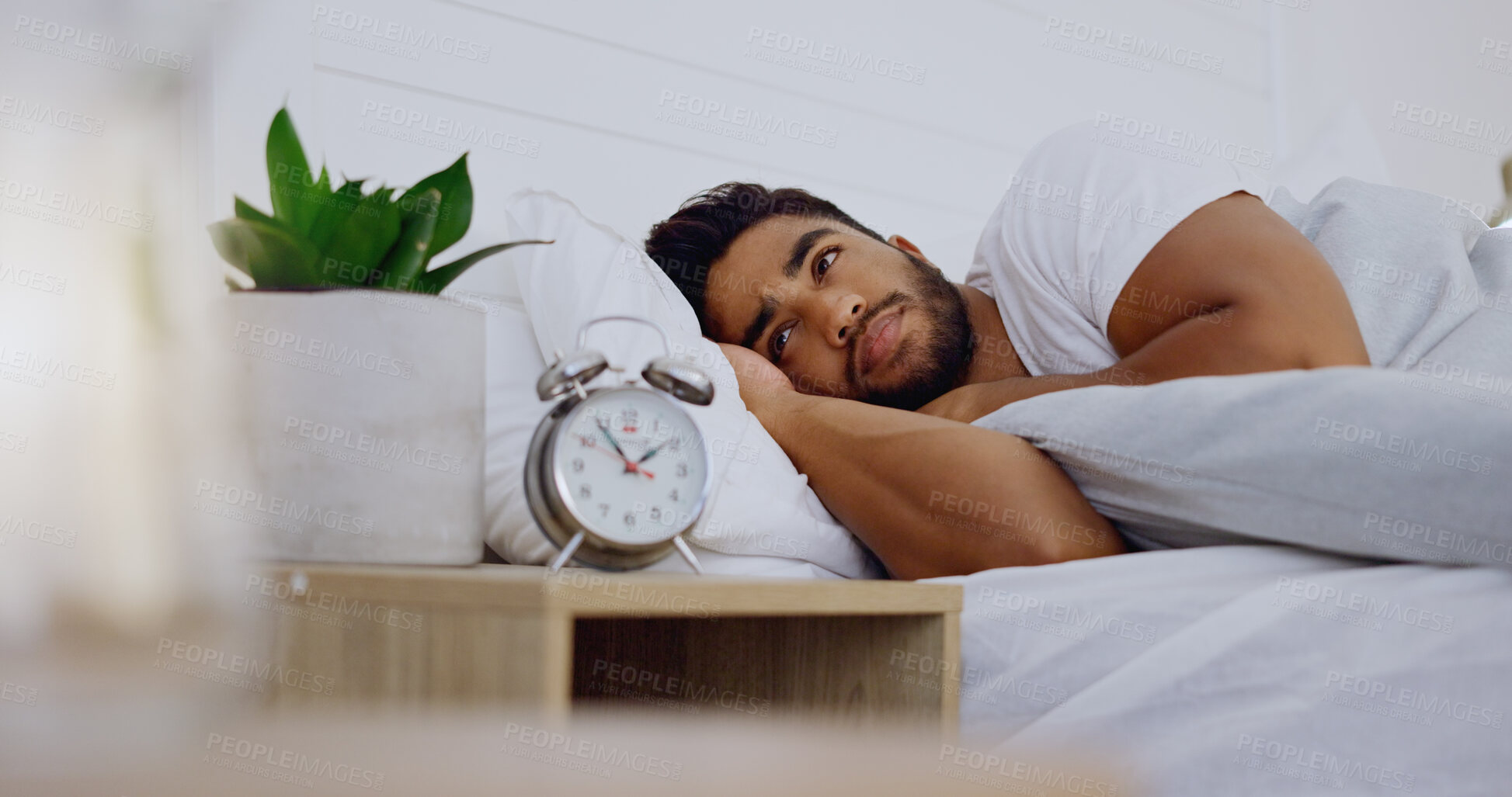 Buy stock photo Stress, insomnia and man in bedroom, anxiety and depression with mental health problems. Male, guy and sleepless in bed, tired and overthinking with fatigue, alarm clock and frustrated with issues