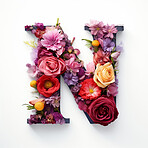 Colorful alphabet capital letter N made with flowers. Spring summer flower font.