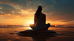 Silhouette of woman meditating in lotus sit position. Yoga in the morning. Mindfulness in nature.