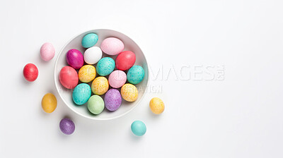 Buy stock photo Bowl of colorful easter eggs on white copyspace background. Chocolate candy in studio