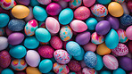 Colorful pile of easter eggs top down view full frame. Festive background banner