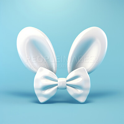 White bunny ears and bow on blue copyspace background in studio. Festive Easter concept