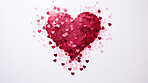 Glitter confetti heart on white copyspace background. Love, anniversary, relationship concept