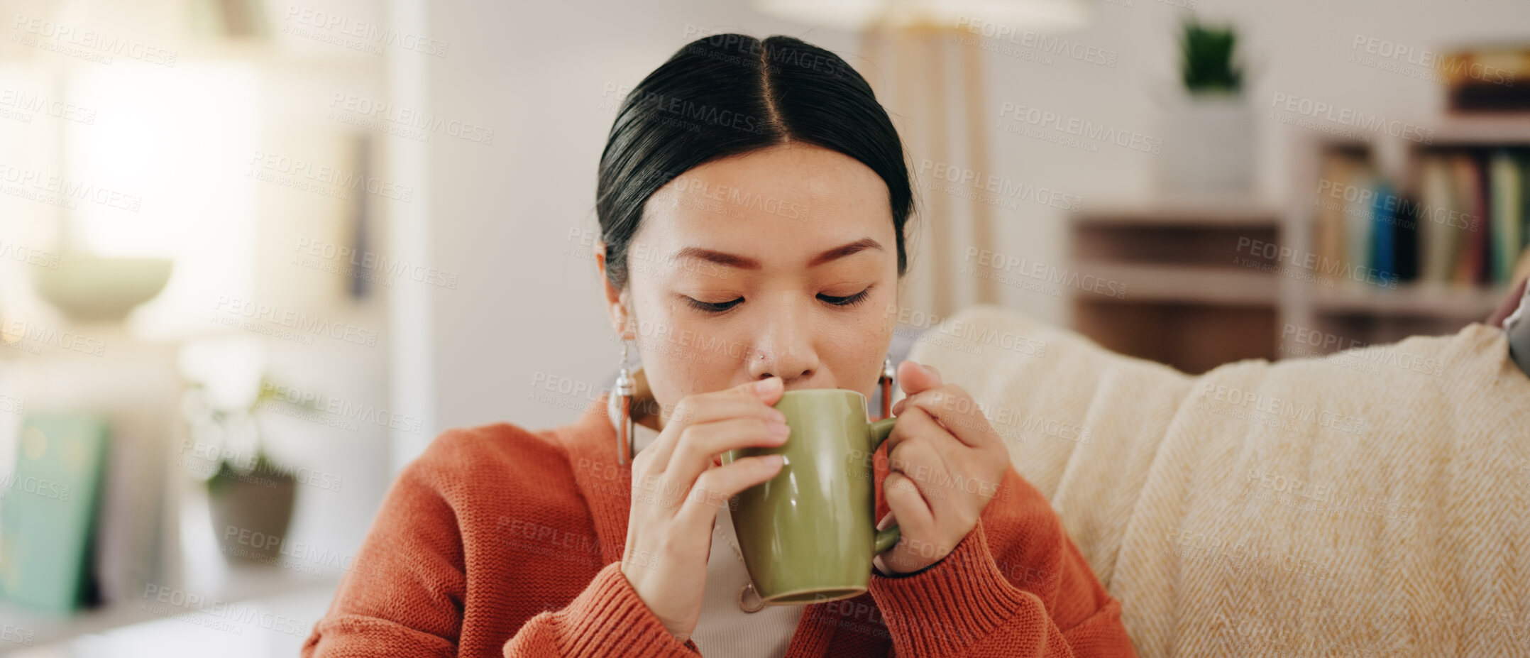 Buy stock photo Thinking, coffee and Asian woman on couch, relax and decision with inspiration, decision and calm in living room. Japan, female and lady with tea, motivation and ideas in lounge, peace and gratitude