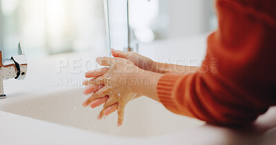 Water, washing hands and cleaning at sink in bathroom for hygiene, wellness or health. Skincare, liquid and woman clean hand to remove bacteria, germs and dirt, sanitary and disinfection in home.