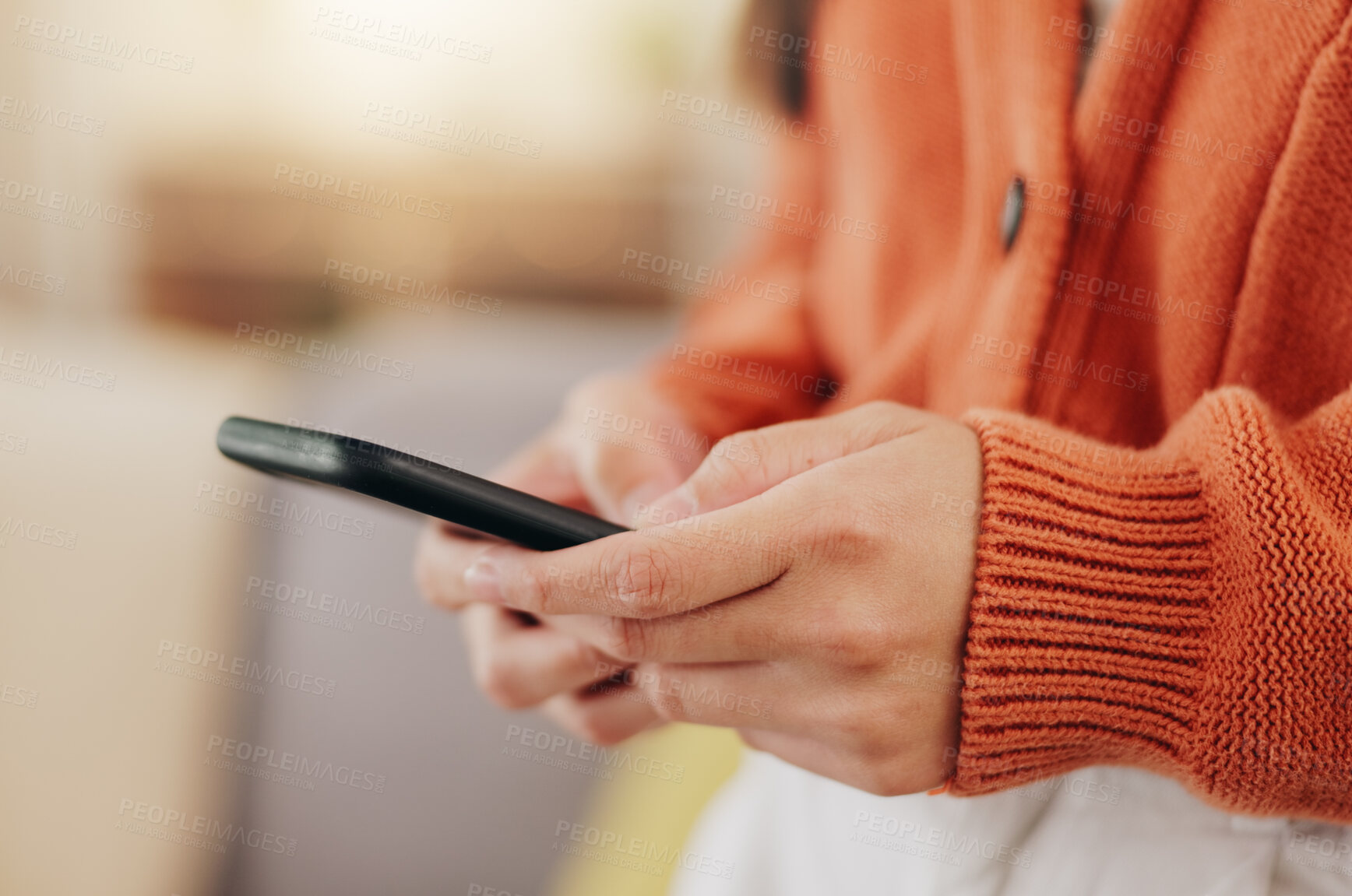 Buy stock photo Relax, text message and phone with hands of woman on sofa for search, social media and connection. App, technology and digital with female in living room at home for contact, post and browsing