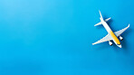 Airplane on blue copyspace background. Sustainable travel, zero emissions and biofuel travel concept.