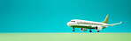 Airplane green and blue copyspace background. Sustainable travel, zero emissions and biofuel concept.