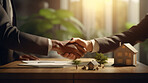 Real estate agent shakes hands with customer after signing. Insurance and investment loan