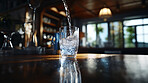 Close up of pouring purified water in glass. Fresh spring mineral water for hydration.