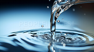 Pouring fresh spring mineral water for hydration. Flowing liquid close up with copy-space.
