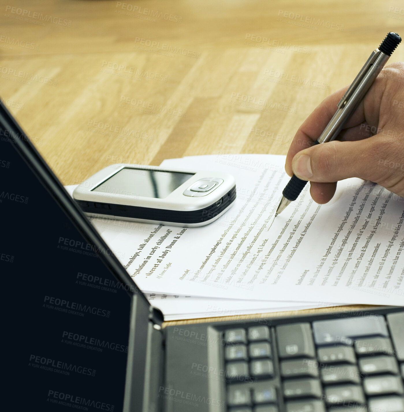 Buy stock photo Laptop and cellphone on table with someone writing notes