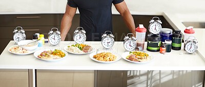 Buy stock photo Table, food and meal plan with watch, diet and man for health, body goal and schedule in home kitchen. Male bodybuilder, clock and plate for planning, preparation and nutrition for muscle development