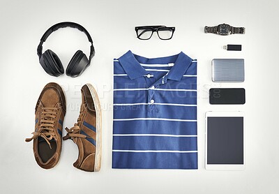 Buy stock photo Flat lay of casual clothes, technology and shoes with a phone, tablet and headphones against background from above. All you need with a watch, USB stick and glasses for creative business workwear