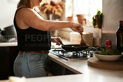 Buy stock photo Cropped shot of a woman preparing a meal at home