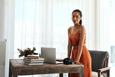 Buy stock photo Cropped portrait of an attractive young businesswoman standing alone in her home office during a day off
