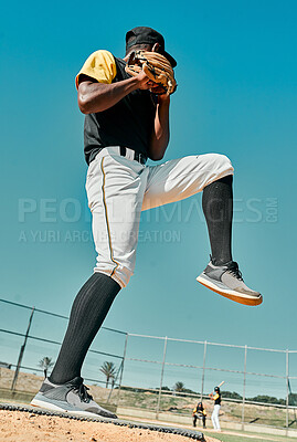 Buy stock photo Shot of a young baseball player getting ready to pitch the ball during a game outdoors