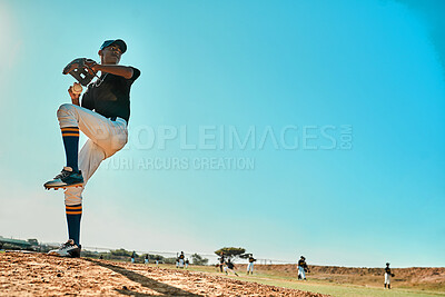 Buy stock photo Shot of a young baseball player pitching the ball during a game outdoors
