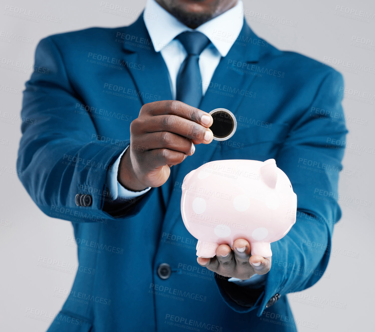 Buy stock photo Studio shot of a businessman holding a piggybank and putting a bitcoin in it against a grey background