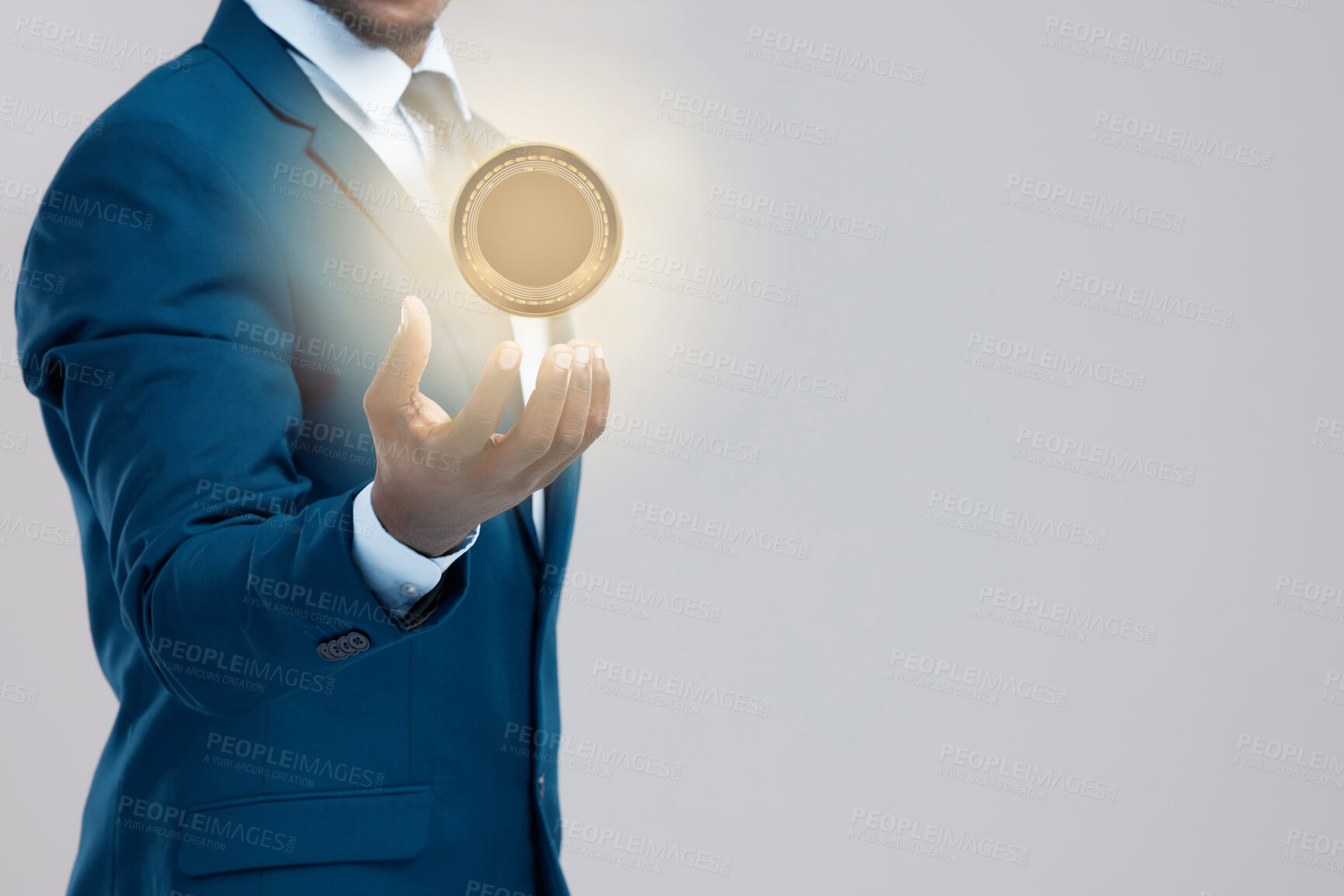 Buy stock photo Studio shot of a businessman holding a bitcoin against a grey background