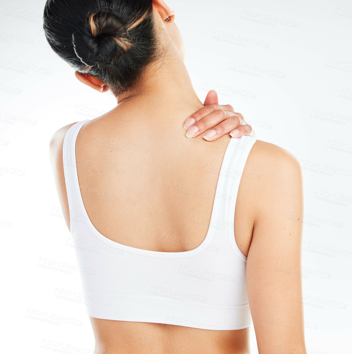 Buy stock photo Fitness, neck pain and woman in studio with injury, muscle inflammation or tension on white background. Back view, health emergency and model with spine problem for sprain, discomfort or wellness