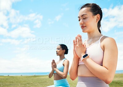 Buy stock photo Meditation, fitness and yoga women in park or beach with blue sky mock up for wellness, mindfulness and inner healing. Fitness, calm and pilates friends meditate with peace mindset in nature mockup