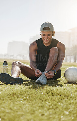 Buy stock photo Fitness, grass and man tie shoes on grass for football training, workout and sports exercise. Summer, energy and health with athlete with sneakers in city park for lifestyle, wellness and soccer ball