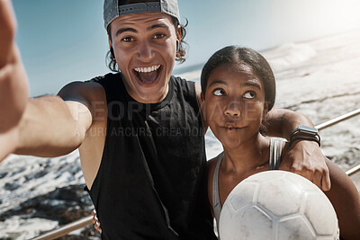 Buy stock photo Soccer ball, couple and fun sports selfie by beach, sea or ocean after fitness, workout and training. Portrait, smile and happy man and comic woman in photograph pov after football exercise in Brazil