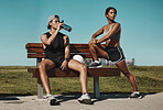 Sports, bench and fitness people with water bottle in a park for outdoor training, workout or wellness with blue sky mock up. Athlete or runner couple relax together after running with summer mockup