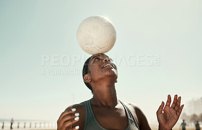 Buy stock photo Head balance, sports and soccer ball with woman athlete in the sun and nature. Fitness, balancing concentration and football exercise of a black person busy with workout, training and healthy cardio