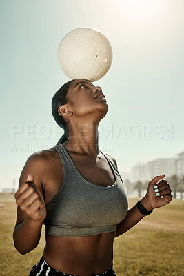 Buy stock photo Woman, soccer ball and balance on head in training grass field, sports ground or fitness training club. Football player, black woman and athlete in exercise practice with wellness goals or motivation