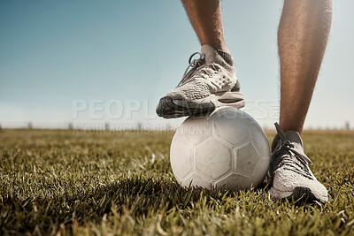 Buy stock photo Soccer, ball and shoes in sport motivation on grass for training, exercise and fitness in the outdoors. Legs of football player standing for healthy sports workout, practice or game on a green field