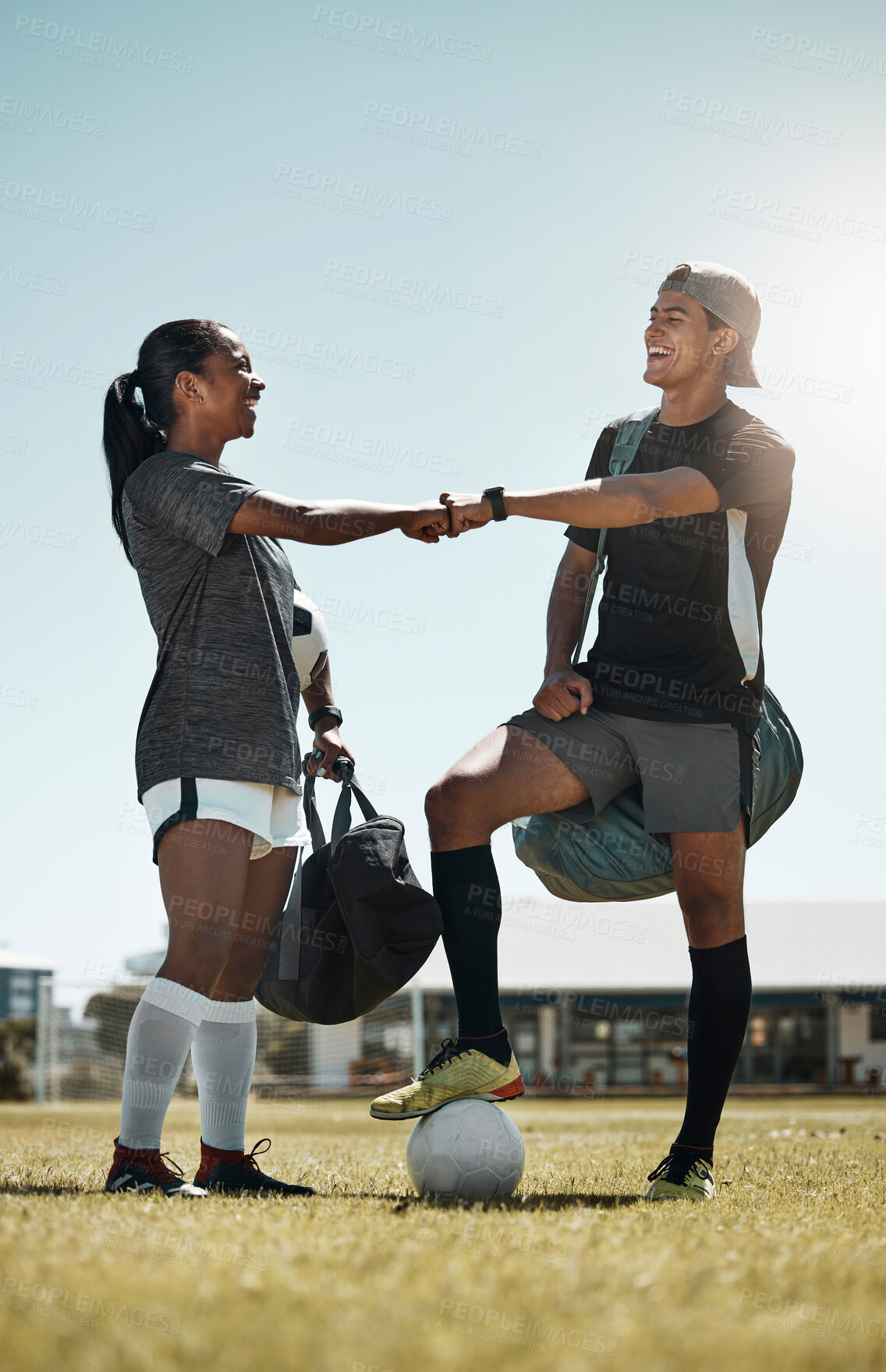 Buy stock photo Fist bump, soccer and football teamwork success for exercise health, friends goal and training. Fitness collaboration, community and sports people before a game on a sport field together with a smile